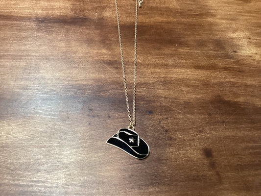 Black cowboy hat on gold chain