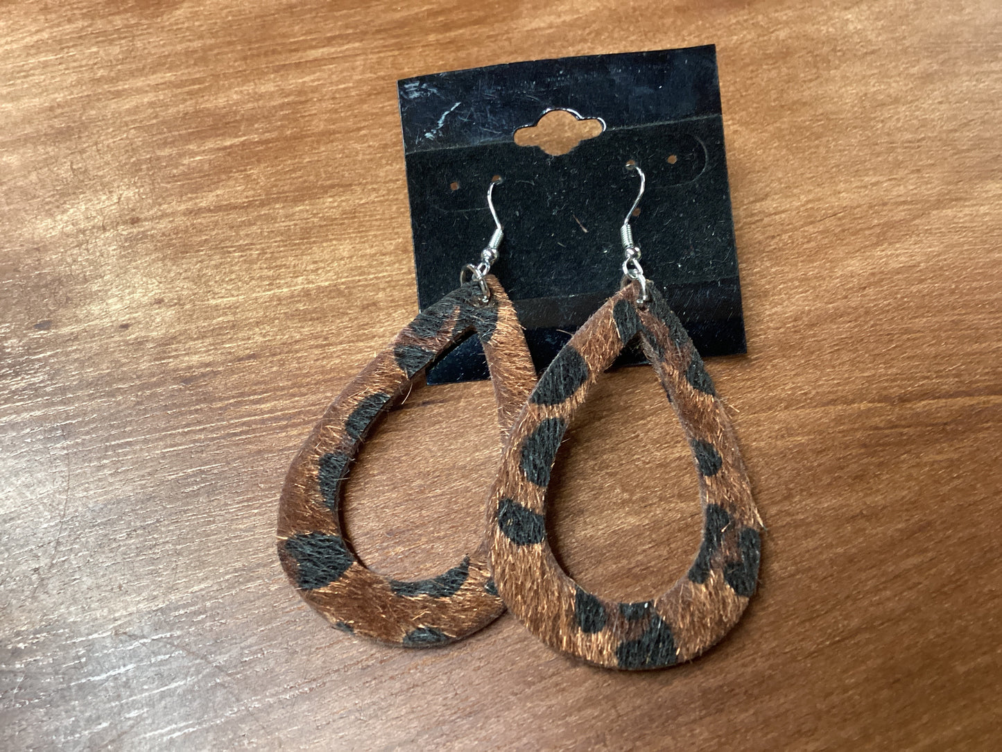 Fuzzy cow print earrings