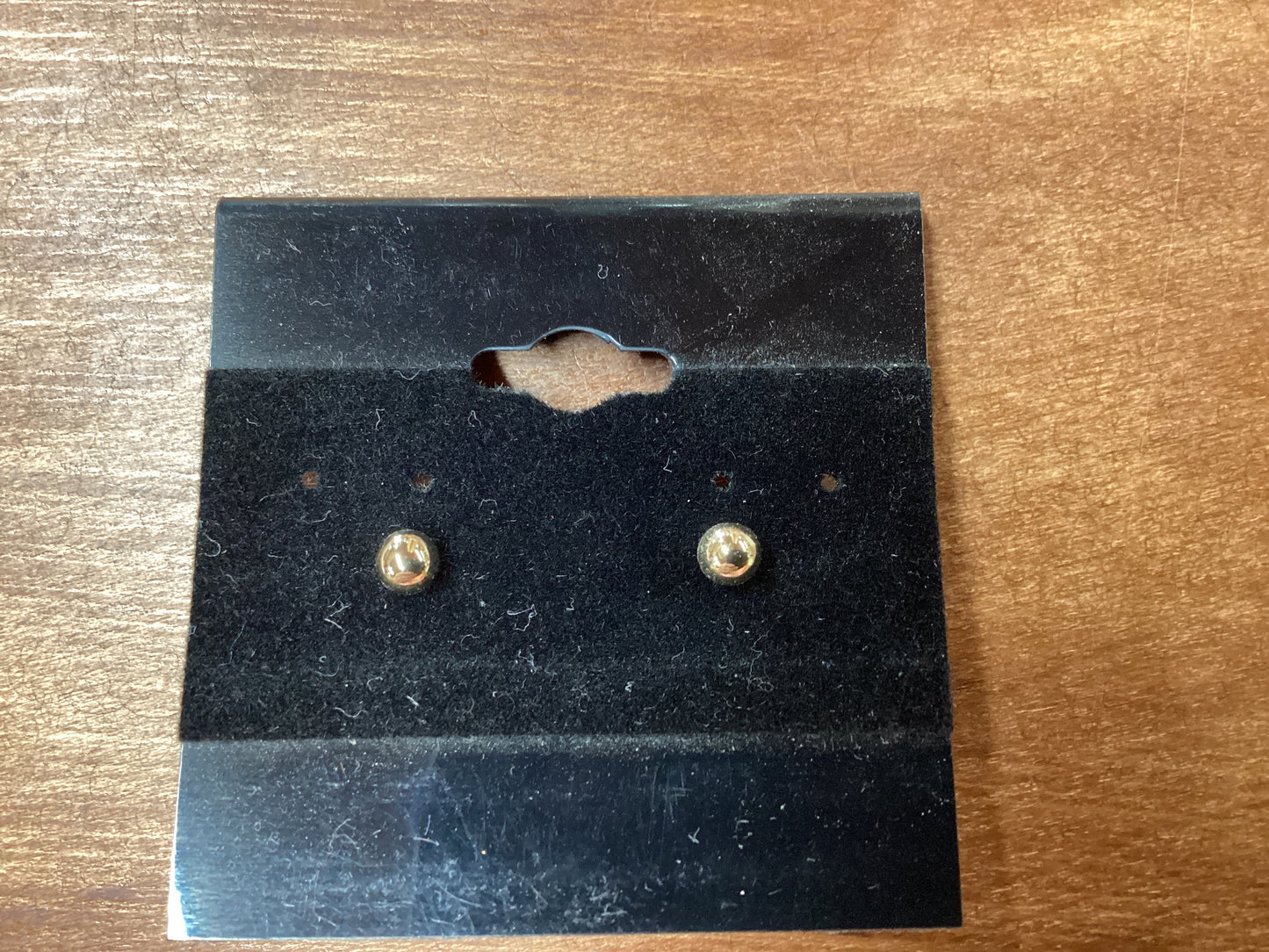 Gold stud earrings