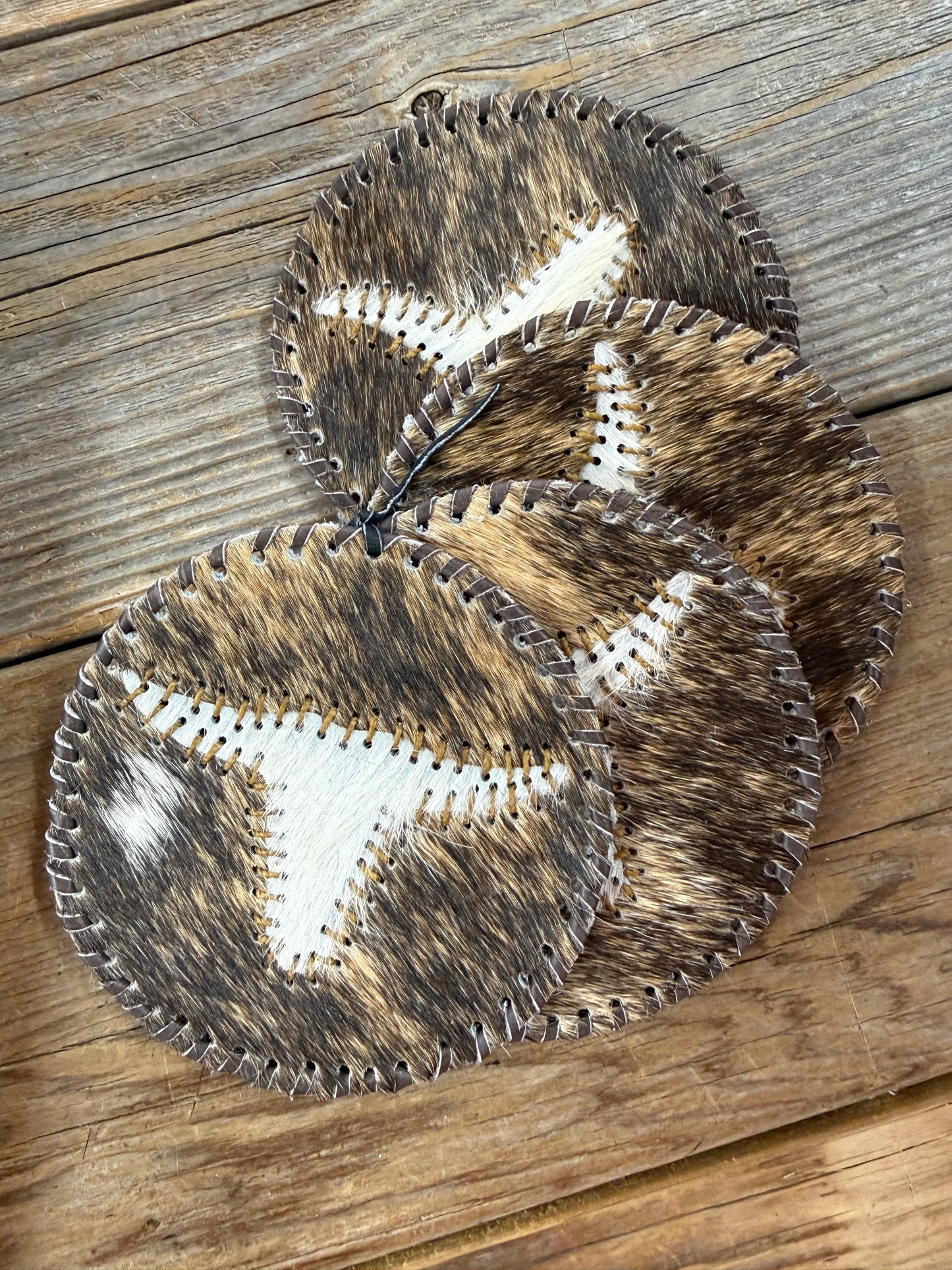 Cowhide Round Coasters Set Of Four Hides and Skins
