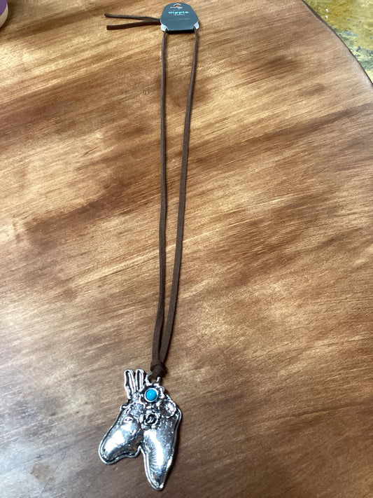 Silver horse head necklace on cord